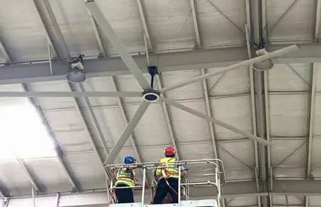 Industrial warehouse showing large ceiling fans for proper air circulation